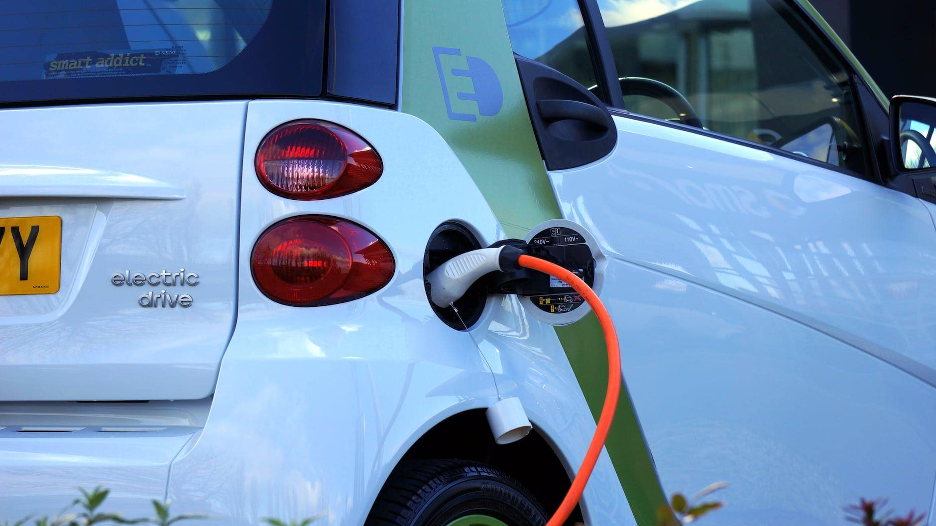 white and orange gasoline nozzle electric vehicles